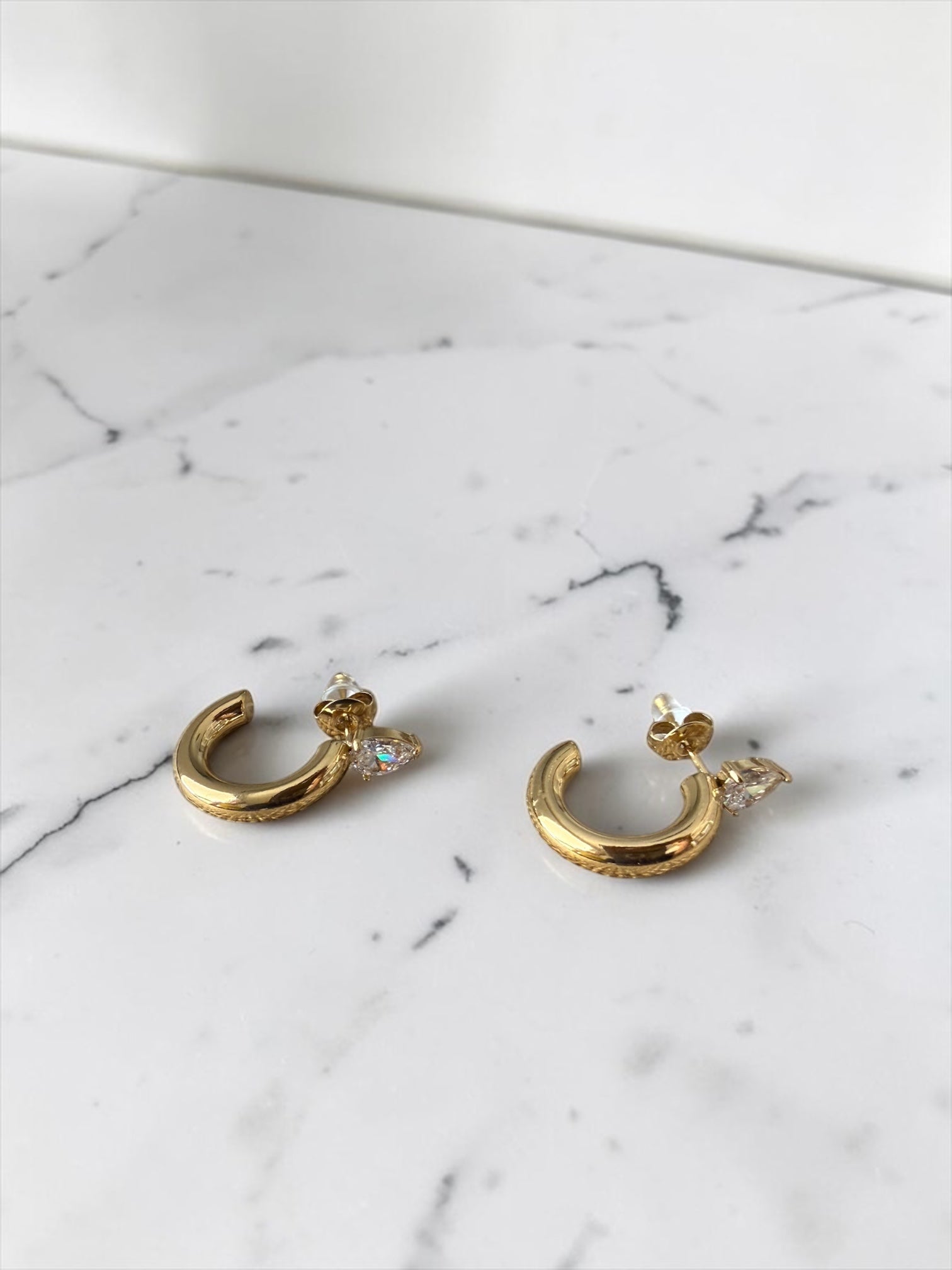 Zircoin hoop earring