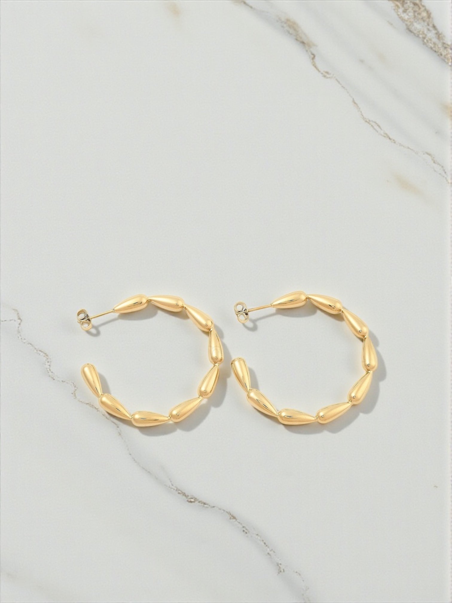 Drop bead hoop earring
