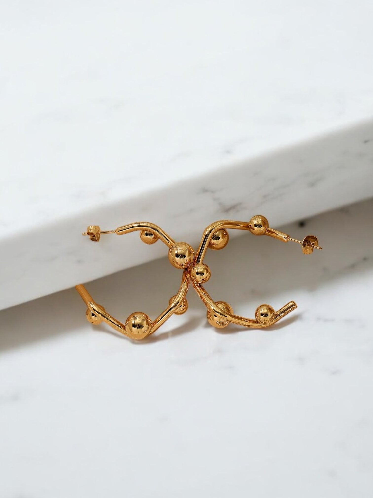 Pellet hoop earring